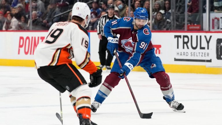 Colorado Avalanche centre Nazem Kadri, right, drives down the ice with the puck as Anaheim Ducks centre Troy Terry defends in the third period of an NHL hockey game Wednesday, Nov. 24, 2021, in Denver. Colorado won 5-2. (David Zalubowski/AP)