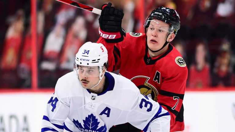 Ottawa Senators' Brady Tkachuk (7) looks to the puck after forcing a pass on Toronto Maple Leafs' Auston Matthews (34) during second period NHL action. (Sean Kilpatrick/CP)