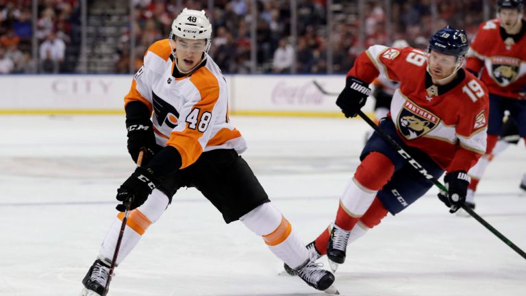 Philadelphia Flyers' Morgan First (48) skates with the puck as Florida Panthers defenseman Mike Matheson (19) defends during the second period of an NHL hockey game. (Lynne Sladky/AP) 