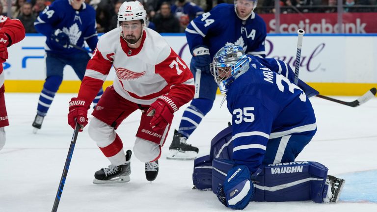 Toronto Maple Leafs goaltender Petr Mrazek (35) eyes his rebound as Detroit Red Wings forward Dylan Larkin (71) grabs the loose puck during third period NHL hockey action. (Nathan Denette/CP)