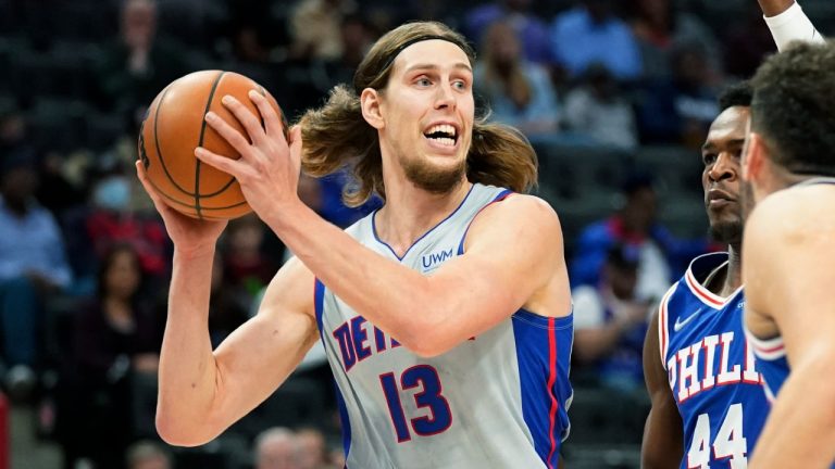 Detroit Pistons forward Kelly Olynyk (13) looks to pass as Philadelphia 76ers forward Paul Reed (44) defends during the first half of an NBA basketball game, Thursday, Nov. 4, 2021, in Detroit. (Carlos Osorio/AP)