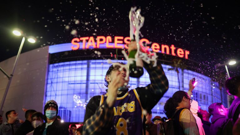 Los Angeles Lakers fans celebrate outside of Staples Center, Sunday, Oct. 11, 2020, in Los Angeles, after the Lakers defeated the Miami Heat in Game 6 of basketball's NBA Finals to win the championship. (Christian Monterrosa/AP Photo) 
