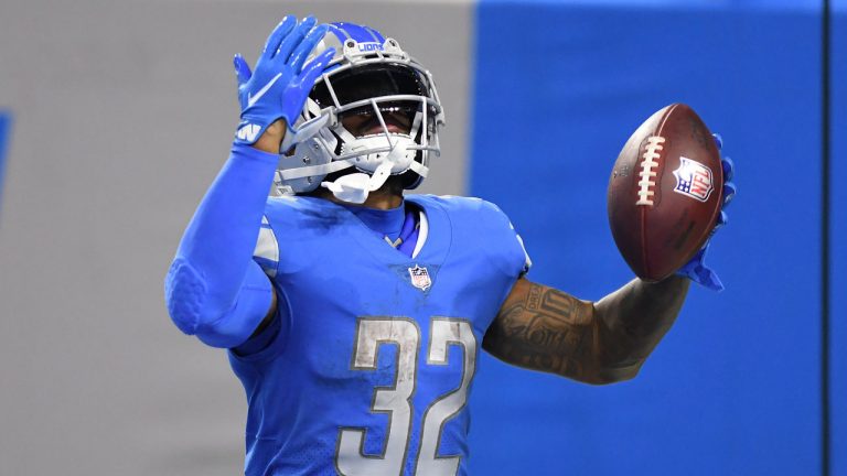 Detroit Lions running back D'Andre Swift (32) celebrates his 43-yard touchdown reception against the San Francisco 49ers in the second half of an NFL football game. (Lon Horwedel/AP) 