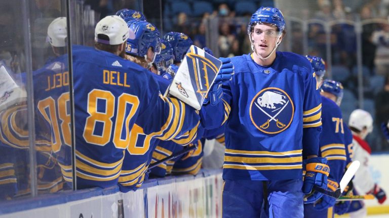 Buffalo Sabres goaltender Aaron Dell (80) celebrates with right wing Tage Thompson (72) after Thompson's goal during the first period of an NHL hockey game against the Montreal Canadiens on Friday, Nov. 26, 2021, in Buffalo, N.Y. (Joshua Bessex/AP)