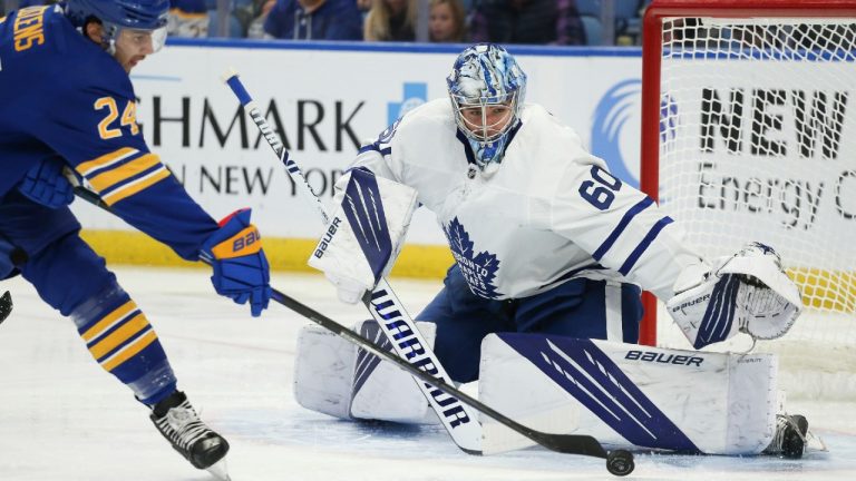 Toronto Maple Leafs goaltender Joseph Woll (60) saves a shot by Buffalo Sabres center Dylan Cozens (24) during the first period of an NHL hockey game. (Joshua Bessex/AP)