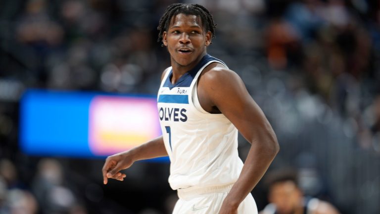 Minnesota Timberwolves forward Anthony Edwards turns to the bench after hitting a 3-point-shot againsdt the Denver Nuggets in the second half of an NBA basketball game Wednesday, Dec. 15, 2021, in Denver. The Timberwolves won 124-107. (David Zalubowski/AP) 
