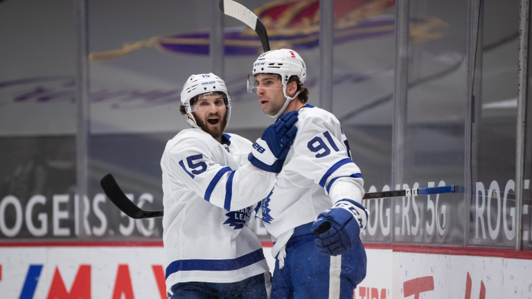 Toronto Maple Leafs' Alexander Kerfoot (15) and John Tavares (91) celebrate Tavares' goal against the Vancouver Canucks during the first period of an NHL hockey game in Vancouver, on Saturday, March 6, 2021. (CP/file)