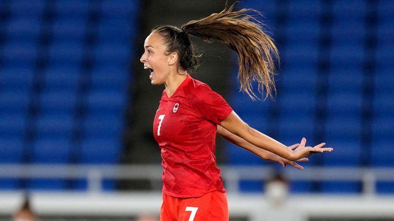 Canada's Julia Grosso celebrates after scoring the winning goal and defeating Sweden in a penalty shootout during the women's final soccer match at the 2020 Summer Olympics, Friday, Aug. 6, 2021. (Andre Penner/AP)