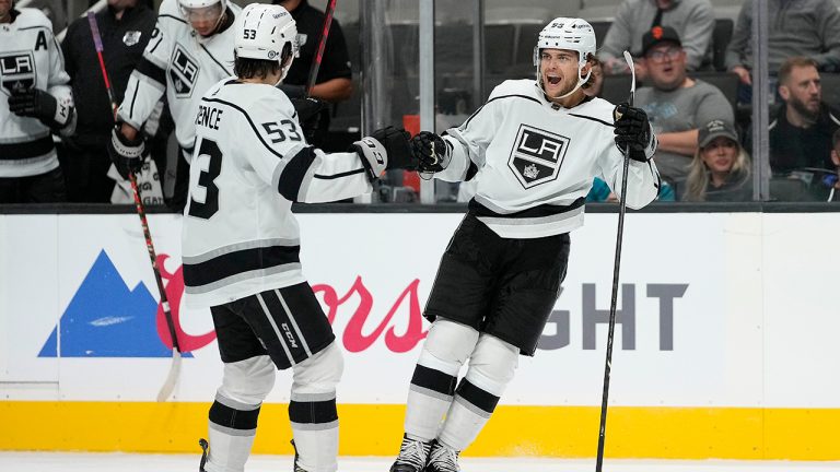 Los Angeles Kings defenseman Kale Clague, right, celebrates with Jordan Spence (53) after Clague scored a goal against the San Jose Sharks during the second period of an NHL hockey preseason game Tuesday, Sept. 28, 2021, in San Jose, Calif. (Tony Avelar/AP)