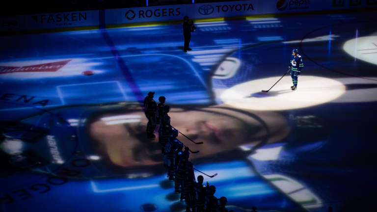 Vancouver Canucks' Quinn Hughes is introduced before the Canucks and Minnesota Wild play an NHL game in Vancouver, on Tuesday, Oct. 26, 2021. (CP/file)