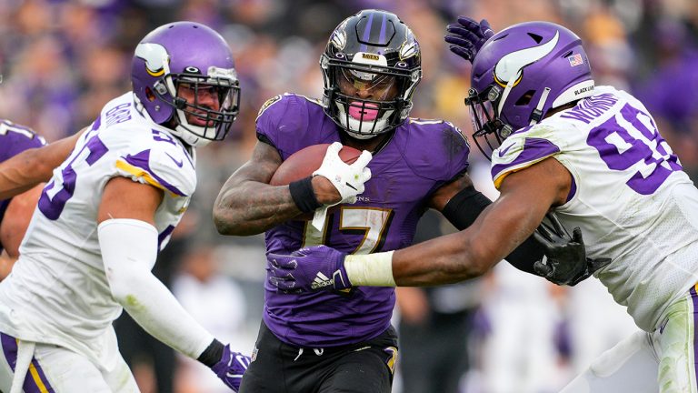 Minnesota Vikings outside linebacker Anthony Barr (55) and defensive end D.J. Wonnum (98) combine against Baltimore Ravens running back Le'Veon Bell (17) during the second half of an NFL football game. (Nick Wass/AP)