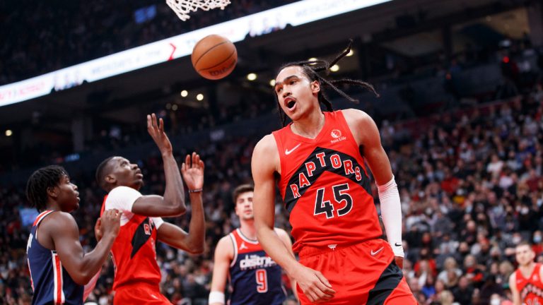 Toronto Raptors guard Dalano Banton (45) celebrates a point against the Washington Wizards during first half NBA action in Toronto, Sunday, Dec. 5, 2021. (Cole Burston/CP) 