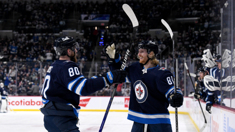 Winnipeg Jets' Kyle Connor (81) celebrates his goal against the Toronto Maple Leafs with Pierre-Luc Dubois (80) during the second period in Winnipeg, Sunday, Dec. 5, 2021. (CP/file)