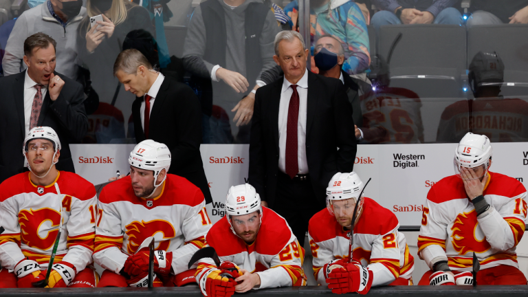 Calgary Flames coach Darryl Sutter and player on the bench react after the San Jose Sharks took a 5-3 lead during the third period of an NHL hockey game Tuesday, Dec. 7, 2021, in San Jose, Calif. (AP/file)