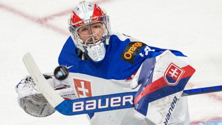 Slovakia goalie Simon Latkoczy makes a save against the U.S. during first period IIHF World Junior Hockey Championship action in Red Deer, Alberta on Sunday, Dec. 26, 2021. (CP/file)