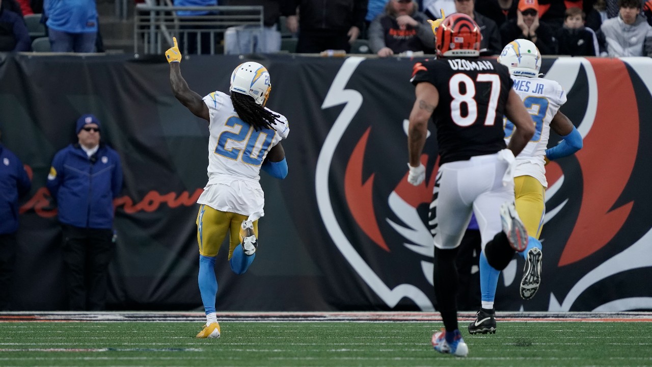 Cincinnati Bengals wide receiver Tee Higgins (85) catches a pass against  Los Angeles Chargers cornerback Tevaughn Campbell (20) during an NFL  football game, Sunday, Dec. 5, 2021, in Cincinnati. (AP Photo/Zach Bolinger