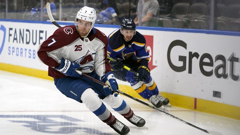 Colorado Avalanche's Devon Toews (7) handles the puck as St. Louis Blues' Jordan Kyrou (25) defends. (Jeff Roberson/AP)