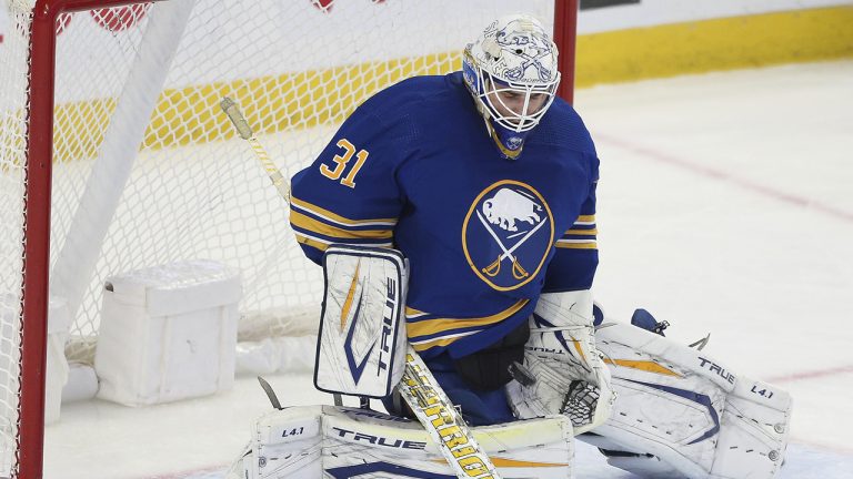 Buffalo Sabres goaltender Dustin Tokarski (31) makes a save during the third period of an NHL hockey game against the Montreal Canadiens. (Joshua Bessex/AP)