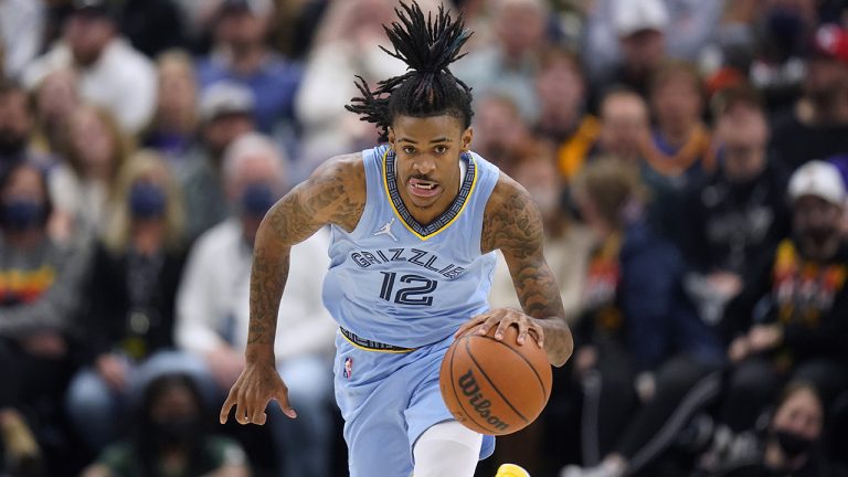 Memphis Grizzlies guard Ja Morant brings the ball up during the second half of the team's NBA basketball game against the Utah Jazz. (Rick Bowmer/AP)