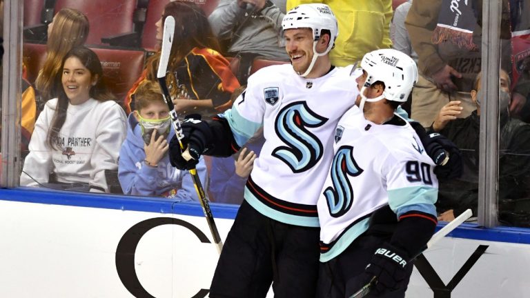 Seattle Kraken defenseman Jamie Oleksiak (24) celebrates an empty-net goal against the Florida Panthers with center Marcus Johansson (90) during the third period of an NHL hockey game Saturday, Nov. 27, 2021, in Sunrise, Fla (Jim Rassol/AP).