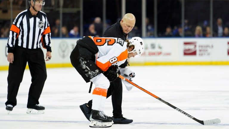 Philadelphia Flyers left wing Joel Farabee is escorted off the ice after being injured during the first period of an NHL hockey game against the New York Rangers, Wednesday, Dec. 1, 2021, at Madison Square Garden in New York. (Mary Altaffer/AP) 