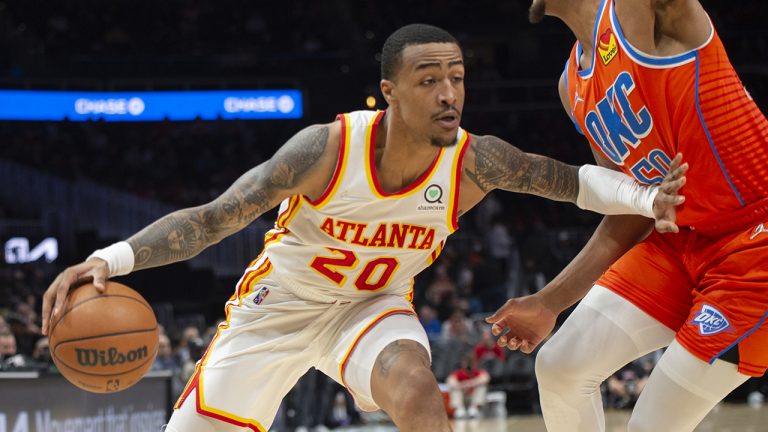 Oklahoma City Thunder's Jeremiah Robinson-Earl (50) defends against Atlanta Hawks' John Collins (20) during the first half of an NBA basketball game. (Hakim Wright Sr./AP)