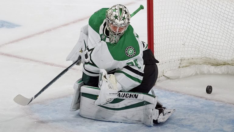 Dallas Stars goalie Anton Khudobin gives up a goal to Minnesota Wild's Rem Pitlick in the first period of an NHL hockey game. (Jim Mone/AP)