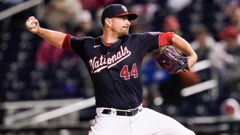 FILE - Washington Nationals reliever Daniel Hudson throws to a Milwaukee Brewers batter during the sixth inning in the second baseball game of a doubleheader May 29, 2021, in Washington. Hudson has returned to the Los Angeles Dodgers on a one-year contract. The Dodgers announced the deal Tuesday night, Nov. 30, for Hudson, who pitched in 40 games for Los Angeles in 2018. (Julio Cortez/AP)