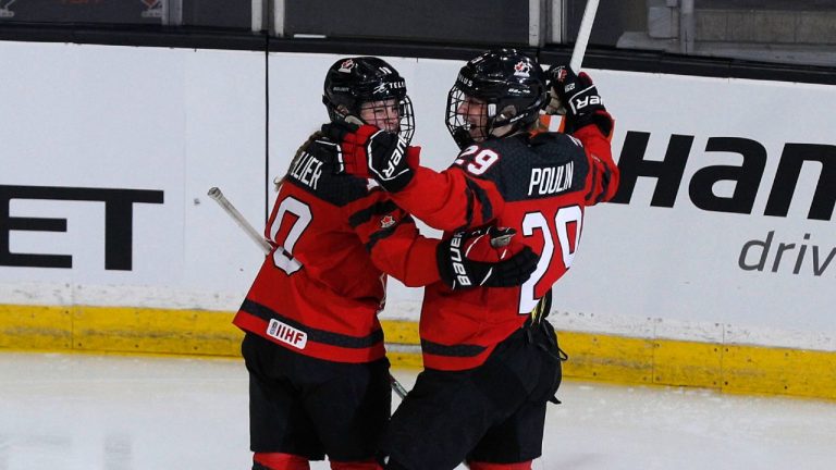 Canada's Brianne Jenner (19) celebrates a goal with teammate Marie-Philip Poulin (29) during second period action of the Rivalry series against the United States, in Kingston, Ont., Sunday, Nov. 21, 2021 (Lars Hagberg/CP).