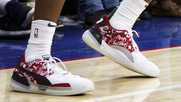 Milwaukee Bucks' Sterling Brown sneakers with "Merry Christmas" on them during the second half of an NBA basketball game against the Philadelphia 76ers in 2019. (Chris Szagola/AP)