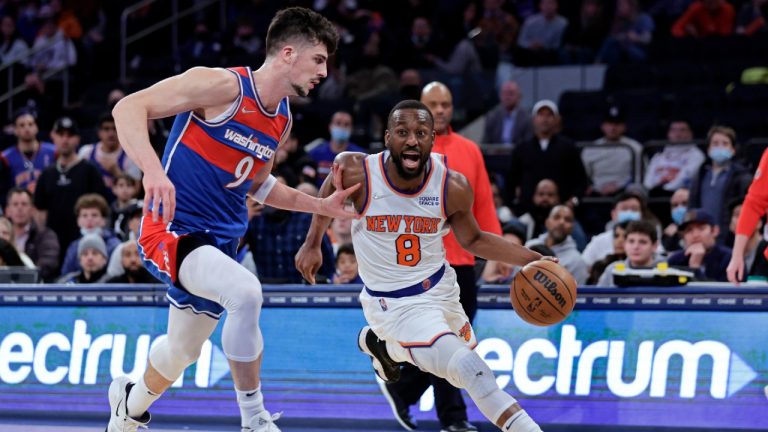 New York Knicks guard Kemba Walker (8) drives past Washington Wizards forward Deni Avdija during the second half of an NBA basketball game Thursday, Dec. 23, 2021, in New York. (Adam Hunger/AP)