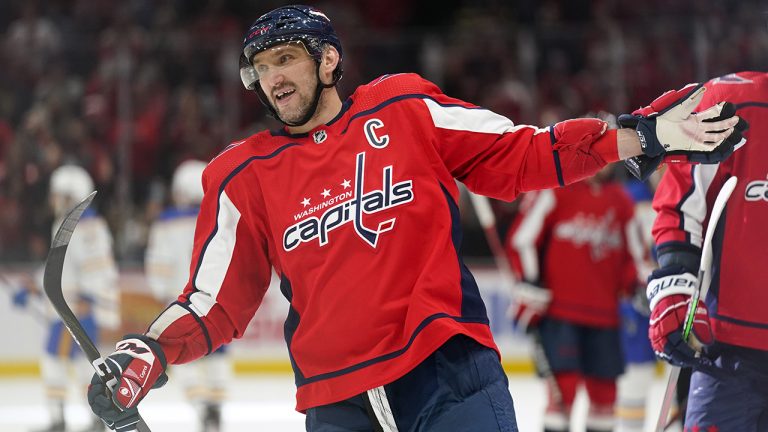 Washington Capitals left wing Alex Ovechkin celebrates after teammate Tom Wilson scored a goal in the third period of an NHL hockey game against the Buffalo Sabres. (Patrick Semansky/AP)