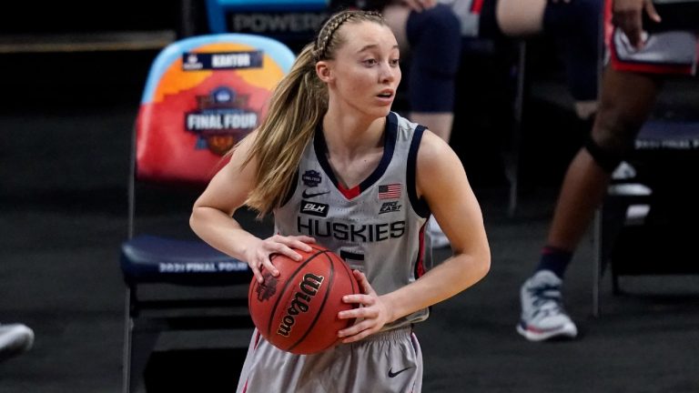 Connecticut guard Paige Bueckers (5) looks to pass up court during the first half of a women's Final Four NCAA college basketball tournament semifinal game against Arizona Friday, April 2, 2021, at the Alamodome in San Antonio. (Eric Gay/AP)