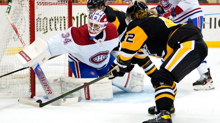 Montreal Canadiens goaltender Jake Allen (34) blocks a shot by Pittsburgh Penguins' Kasperi Kapanen (42) during the second period of an NHL hockey game in Pittsburgh, Tuesday, Dec. 14, 2021 (Gene J. Puskar/AP).