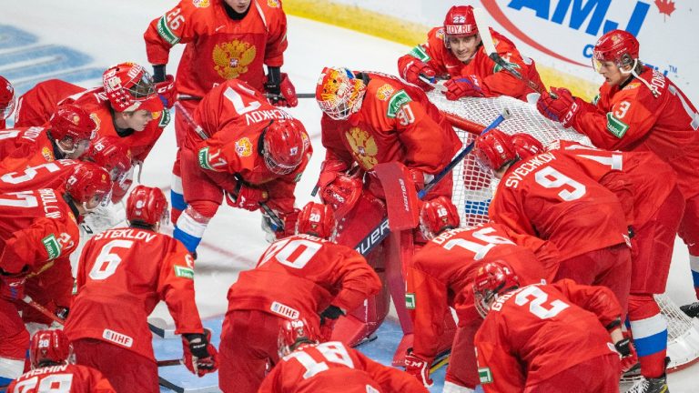 Team Russia gathers around goaltender Askarov Yaroslav
prior to first period against team Sweden during IIHF World Junior Hockey Championship action in Red Deer, Alta., Sunday, Dec. 26, 2021. (Jonathan Hayward/CP)