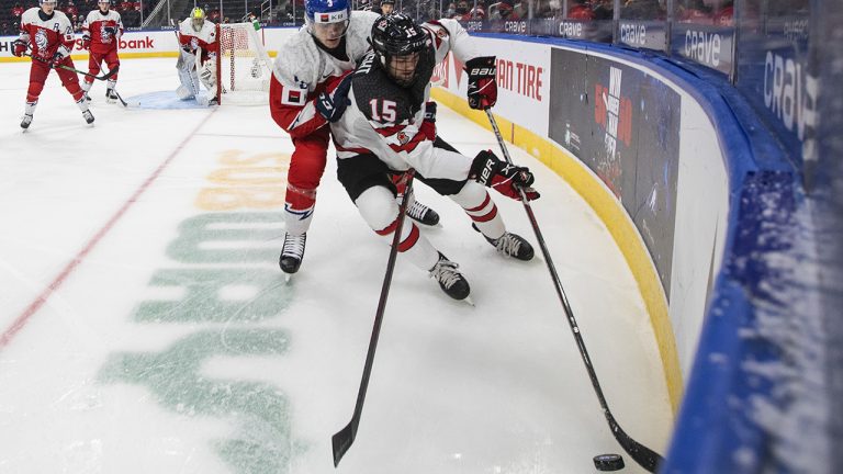 Canada's Shane Wright (15) and Czech Republic's David Spacek (3) battle for the puck during first period IIHF World Junior Hockey Championship action in Edmonton on Sunday, December 26, 2021. (Jason Franson/CP)