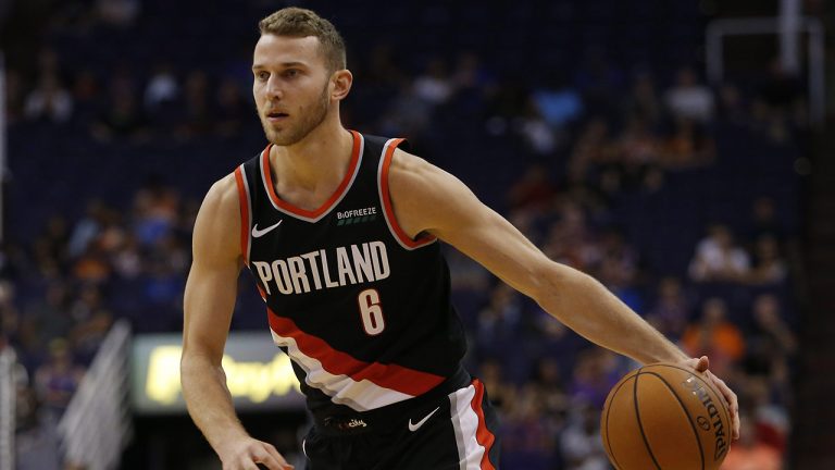 In this Oct. 5, 2018, file photo, Portland Trail Blazers guard Nik Stauskas (6) moves the ball in the first half during an NBA preseason basketball game against the Phoenix Suns. (Rick Scuteri, File/AP)