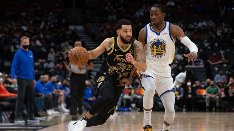 Toronto Raptors' Fred VanVleet (left) drives at Golden State Warriors' Jonathan Kuminga during first half NBA basketball action in Toronto on Saturday, December 18, 2021. (Chris Young/CP)