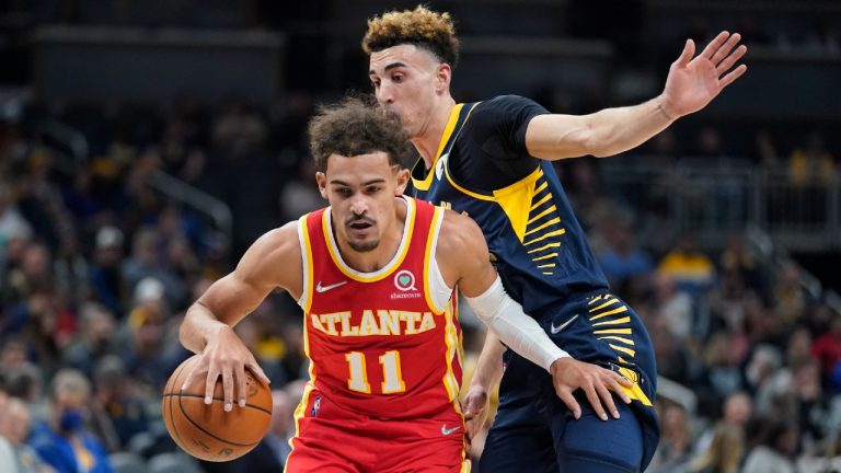 Atlanta Hawks' Trae Young (11) is defended by Indiana Pacers' Chris Duarte during the first half of an NBA basketball game Wednesday, Dec. 1, 2021, in Indianapolis (Darron Cummings/AP).