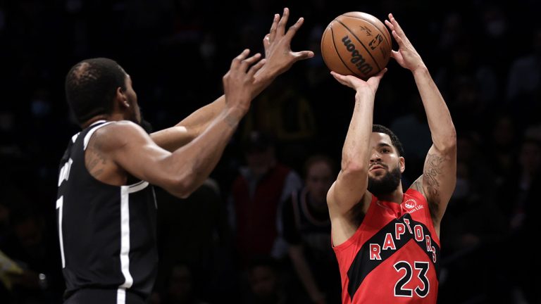 Toronto Raptors guard Fred VanVleet (23) shoots in front of Brooklyn Nets forward Kevin Durant. (Adam Hunger/AP)