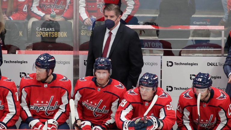 Washington Capitals head coach Peter Laviolette , center top, looks on during the first period of an NHL hockey game against the Los Angeles Kings, Sunday, Dec. 19, 2021, in Washington. (Luis M. Alvarez/AP)