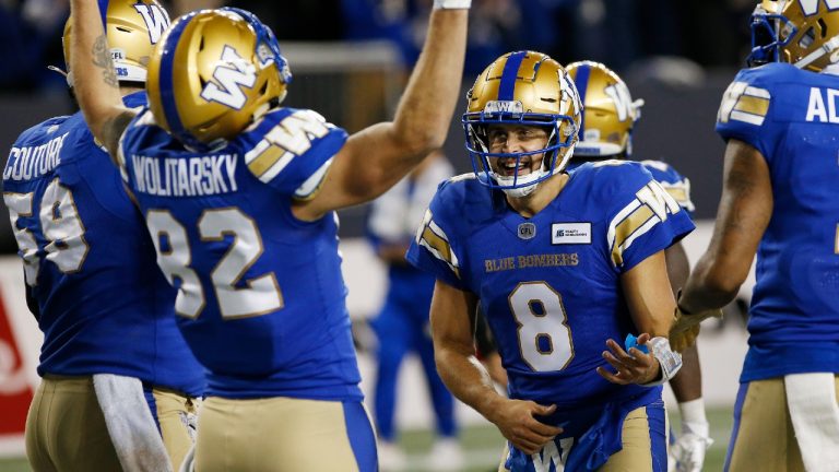 Winnipeg Blue Bombers' Drew Wolitarsky (82) and quarterback Zach Collaros (8) celebrate Wolitarsky’s touchdown against the Montreal Alouettes during the second half of CFL action in Winnipeg Saturday, November 6, 2021. THE (John Woods/CP) 