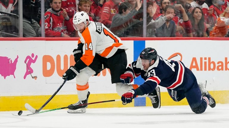 Philadelphia Flyers centre Sean Couturier, left, and Washington Capitals right wing Tom Wilson chase after a puck in the third period of an NHL hockey game, Saturday, Nov. 6, 2021, in Washington. (Patrick Semansky/AP)