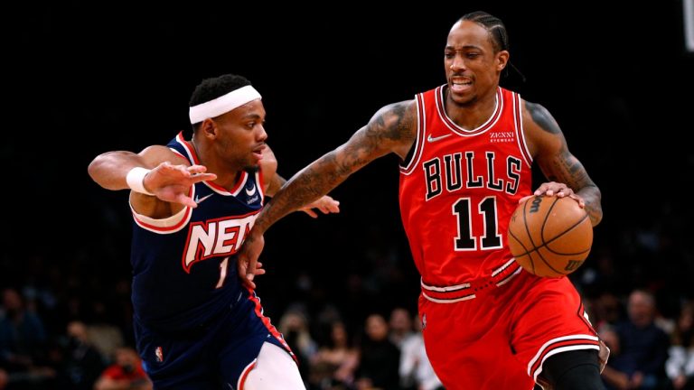 Chicago Bulls forward DeMar DeRozan (11) drives to the basket against Brooklyn Nets forward Bruce Brown (1) during the first half of an NBA basketball game in New York, Saturday, Dec. 4, 2021. (Noah K. Murray/AP)