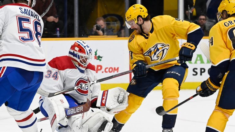 Montreal Canadiens goaltender Jake Allen (34) blocks a shot by Nashville Predators left wing Filip Forsberg (9) during the second period of an NHL hockey game Saturday, Dec. 4, 2021, in Nashville, Tenn. (Mark Zaleski/AP)