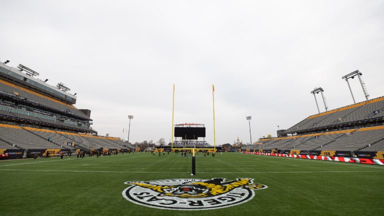 Hamilton Tiger-Cats teammates take part in a practice at Tim Hortons Field during the CFL's Grey Cup week in Hamilton, Friday, December 10, 2021. The Hamilton Tiger-Cats will play the Winnipeg Blue Bombers in the 108th Grey Cup on Sunday. (Nick Iwanyshyn/CP) 