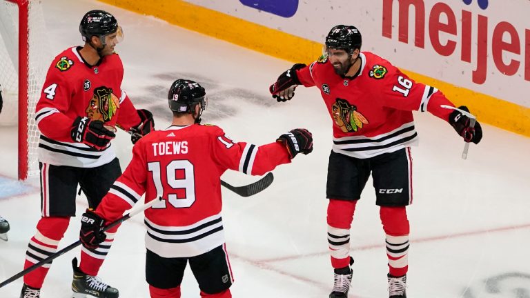 Chicago Blackhawks' Jujhar Khaira (16) celebrates his goal with Seth Jones (4) and Jonathan Toews during the second period of an NHL hockey game against the Pittsburgh Penguins Tuesday, Nov. 9, 2021, in Chicago. (Charles Rex Arbogast/AP) 
