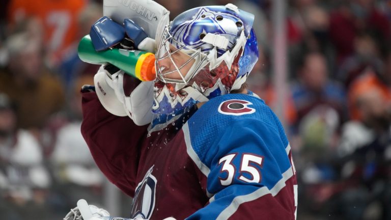 Colorado Avalanche goaltender Darcy Kuemper cools off during a time out in the second period of an NHL hockey game against the Florida Panthers Sunday, Dec. 12, 2021, in Denver. (David Zalubowski/AP) 