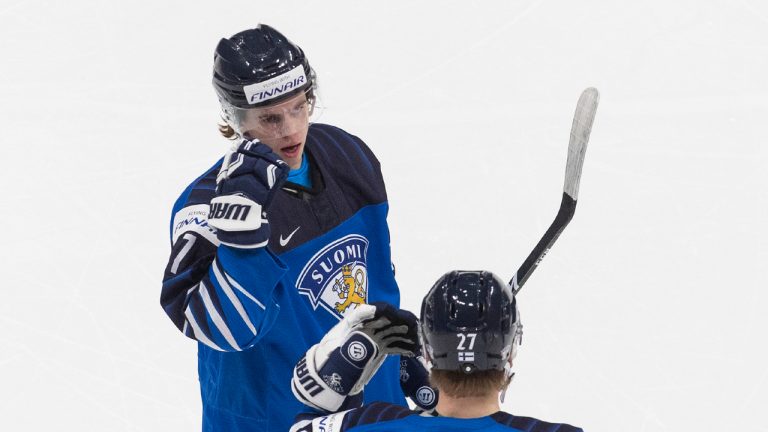 Finland's Topi Niemela (7) and Juuso Parssinen (27) celebrate a goal against the United States during second period IIHF World Junior Hockey Championship pre-competition action in Edmonton on Tuesday, December 22, 2020. (Jason Franson/CP) 