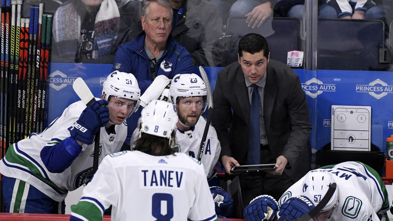 Vancouver Canucks' assistant coach Nolan Baumgartner speaks to players during a break in the first period of NHL action against the Winnipeg Jets. (Fred Greenslade/CP)